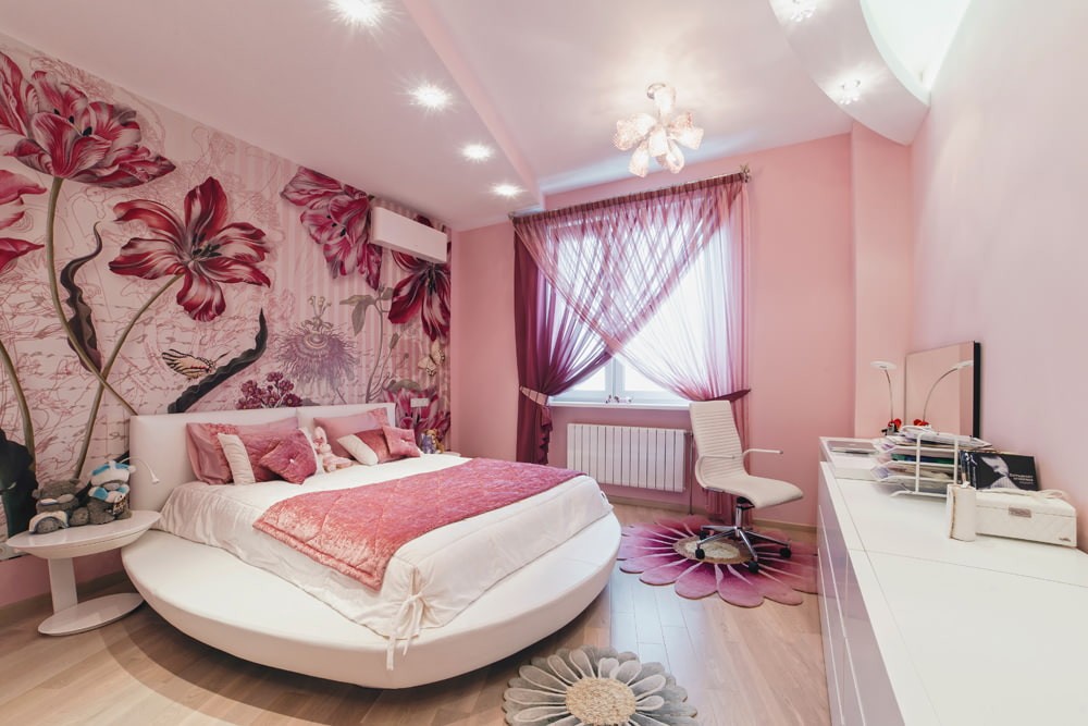 Круглая кровать в спальне розового цвета