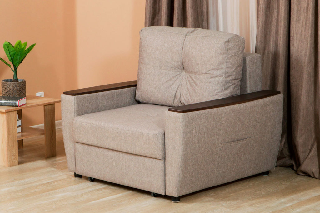 Кресло кровать в тканевой обивке с подлокотниками и подушкой