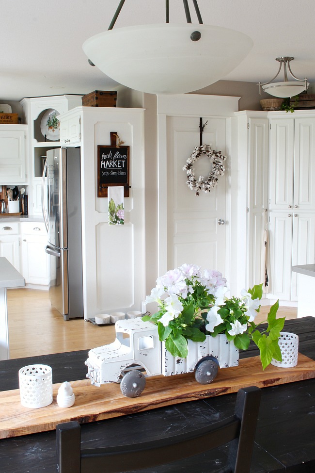 Vintage truck flower planter used as a centerpiece on a kitchen table.